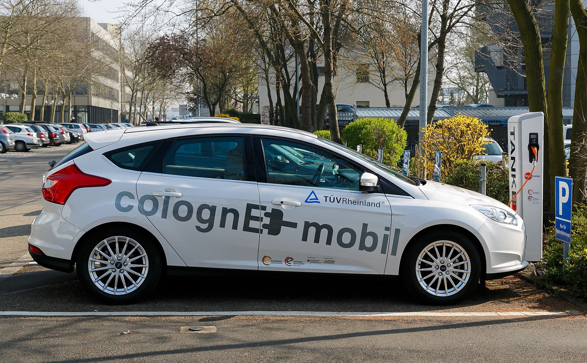 Electric car plugged into a public charging point